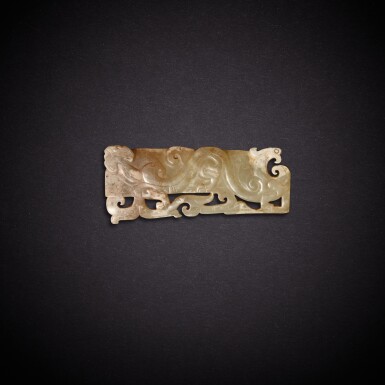 View full screen - View 1 of Lot 7882. A pale celadon jade 'dragon and phoenix' pendant, Western Han dynasty | 西漢 青白玉龍鳳紋珮.