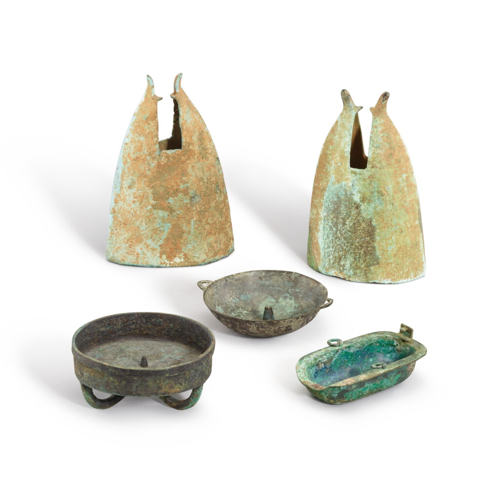 View full screen - View 1 of Lot 3054. Two 'ram's horns' bronze bells, Southwest China, Han dynasty and three bronze oil lamps, Song dynasty 漢 中國西南部 青銅鐘兩件 及 宋 青銅燈三件.