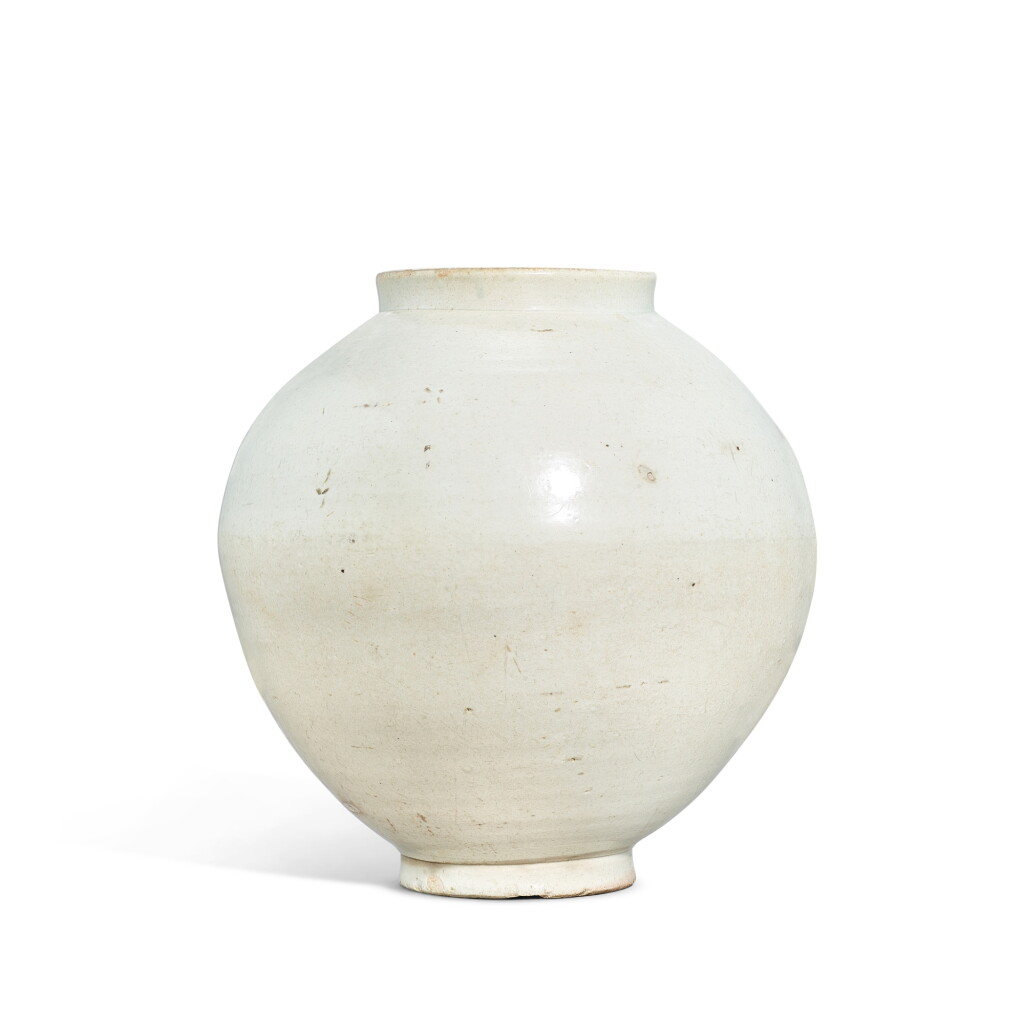 View full screen - View 1 of Lot 5871. A white-glazed moon jar, Korea, Joseon dynasty, 18th century | 朝鮮王朝十八世紀 韓國白釉滿月花罐.