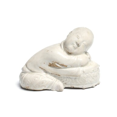 View full screen - View 1 of Lot 70. A rare 'Ding' figure of a sleeping boy, Northern Song dynasty.