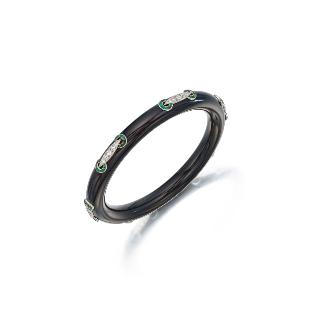 View full screen - View 1 of Lot 142. A Jet, Diamond and Emerald Bangle-Bracelet.