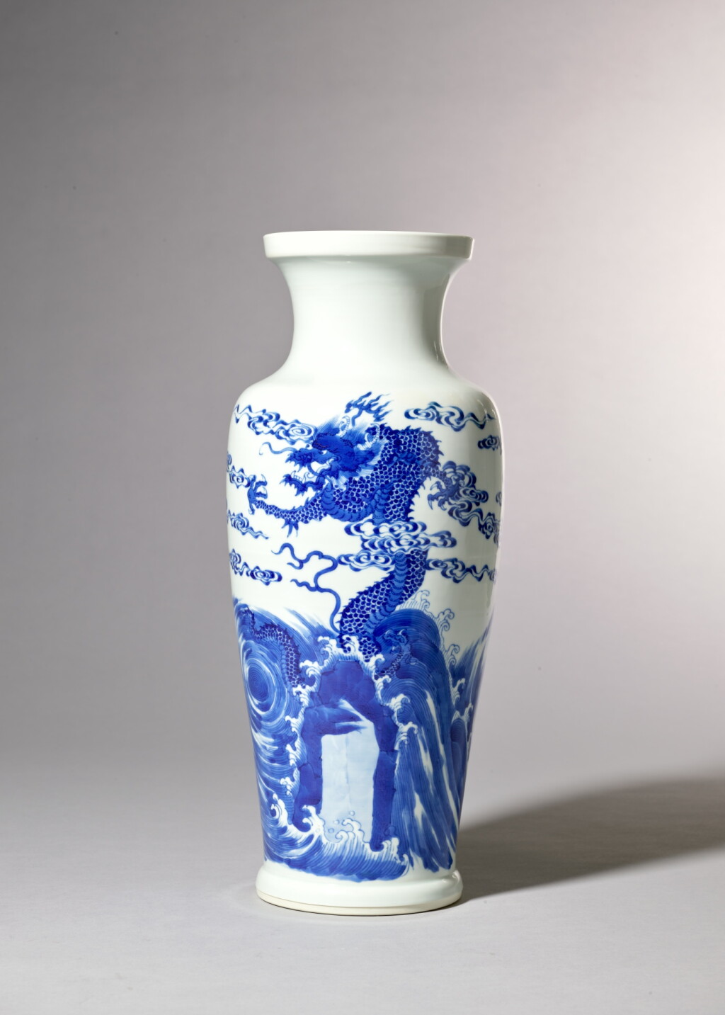 View full screen - View 1 of Lot 3633. A fine and rare blue and white 'dragon' vase, Mark and period of Kangxi | 清康熙 青花海水雲龍紋盤口觀音尊 《大清康熙年製》款.