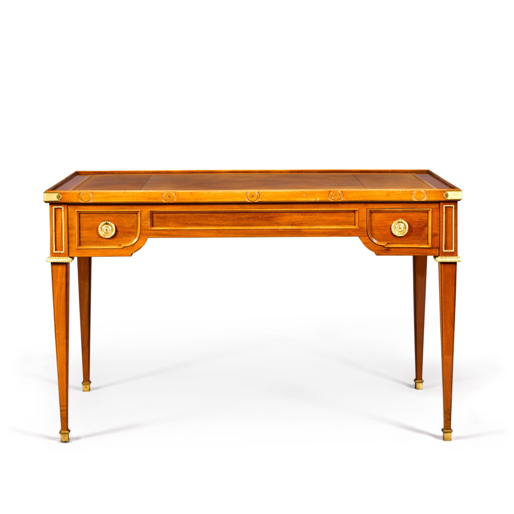 View full screen - View 1 of Lot 17. A Louis XVI gilt-bronze mounted mahogany tric-trac table by Jean-Henri Riesener, circa 1780.