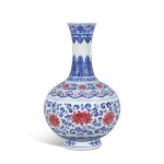 An exceptionally rare underglaze-blue and puce-enamelled 'lotus' bottle vase, Seal mark and period of Qianlong