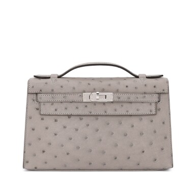 View full screen - View 1 of Lot 546. Gris Mouette Ostrich Kelly Pochette Palladium Hardware, 2025.