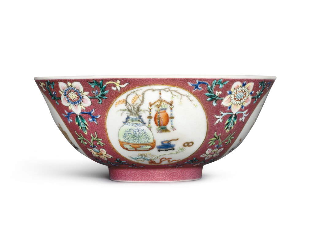 View full screen - View 1 of Lot 351. A ruby-ground famille-rose and underglaze-blue sgraffiato 'medallion' bowl, Seal mark and period of Daoguang | 清道光 胭脂紅地軋道粉彩開光博古圖盌 《大清道光年製》款.