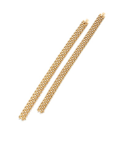 View full screen - View 1 of Lot 210. Pair of Gold and Diamond Bracelets.