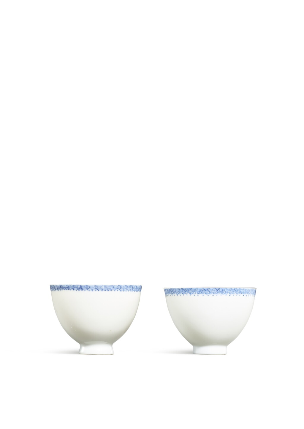 View full screen - View 1 of Lot 3623. A fine pair of 'eggshell' blue and white 'keyfret' cups, Marks and period of Kangxi | 清康熙 青花回紋薄胎盃一對 《大清康熙年製》款.