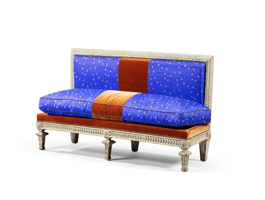 View full screen - View 1 of Lot 124. A carved and grey painted bench, partly Louis XVI, circa 1775 | Banquette hêtre sculpté et laqué gris en partie d'époque Louis XVI, vers 1775.