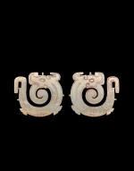A pair of white jade 'dragon' pendants, Late Western Zhou dynasty | 西周晚期 龍紋玉珮一對