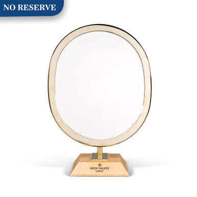 View full screen - View 1 of Lot 720. BRASS-FINISH OVAL BOUTIQUE MIRROR WITH MAPLE VENEERED BASE.