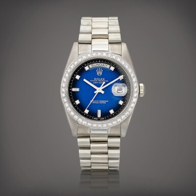 View full screen - View 1 of Lot 723. Day-Date, Reference 18049 | A white gold and diamond-set wristwatch with day, date, blue dégradé dial and bracelet, Circa 1983 | 勞力士 | Day-Date 型號18049 | 白金鑲鑽石鏈帶腕錶,備日期、星期顯示及藍色錶盤,約1983年製.
