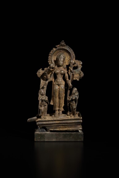 View full screen - View 1 of Lot 834. A bronze figure of Lalita and purushas, Eastern India, Bihar, circa 9th century.