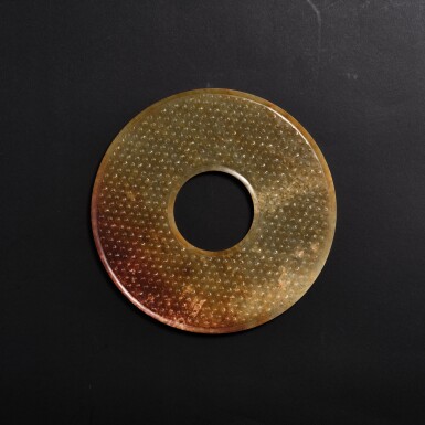 View full screen - View 1 of Lot 3512. A yellowish-celadon jade disc, bi, Western Han dynasty | 西漢 青黃玉穀紋璧.