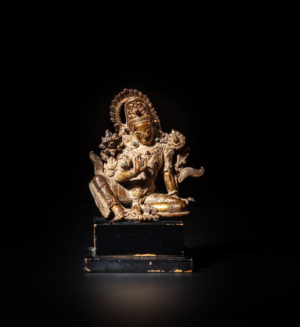 View full screen - View 1 of Lot 27. A gilt-bronze seated figure of Indra, Nepal, 15th - 16th century | 尼泊爾 十五至十六世紀 鎏金銅因陀羅坐像.