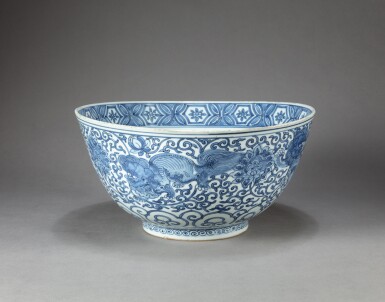View full screen - View 1 of Lot 174. A large blue and white 'lion and phoenix' punch bowl, 17th century | 十七世紀 佛獅鳳紋大盌.