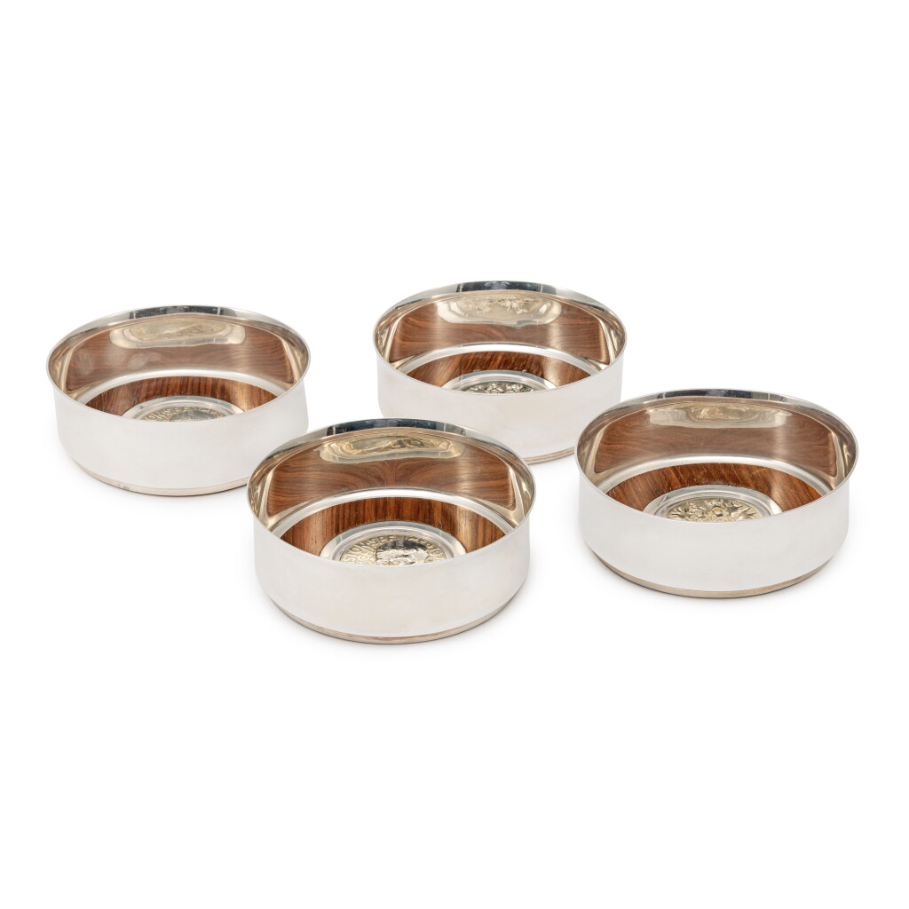 View full screen - View 1 of Lot 1045. Two Pairs of English Silver Winston Churchill Commemorative Wine Coasters, Garrard, London, 1973 .