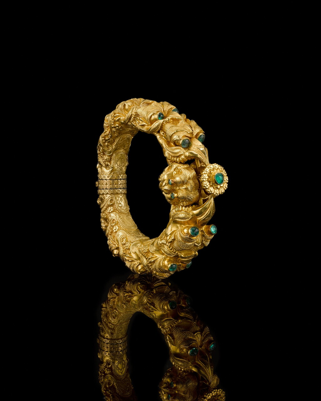View full screen - View 1 of Lot 127. An emerald-set gold bracelet, South India, 19th century.