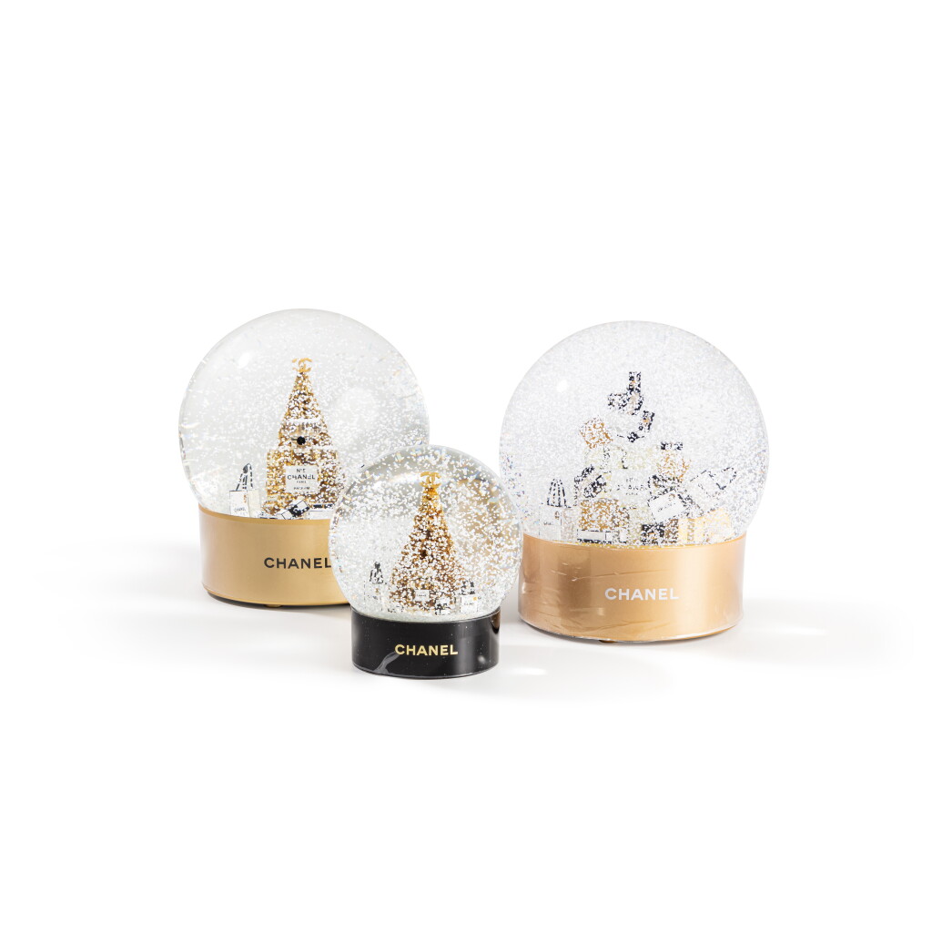 View full screen - View 1 of Lot 526. Two Golden Christmas Tree Snow Globes and One Golden Presents Snow Globe.