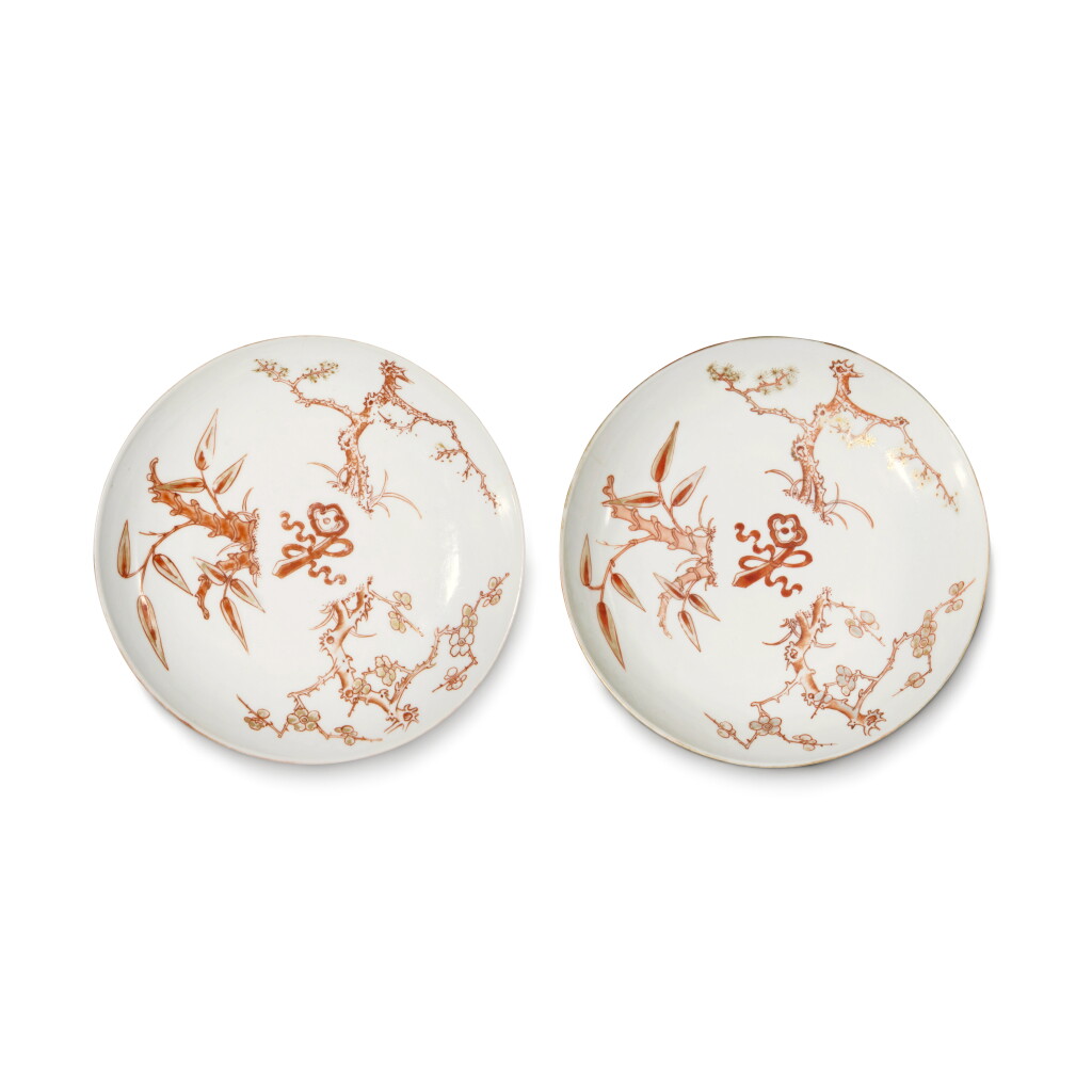 View full screen - View 1 of Lot 606. A pair of small iron-red and gilt 'Three Friends of Winter' dishes, Seal marks and period of Daoguang | 清道光 礬紅彩描金歲寒三友圖小盤一對 《大清道光年製》款.