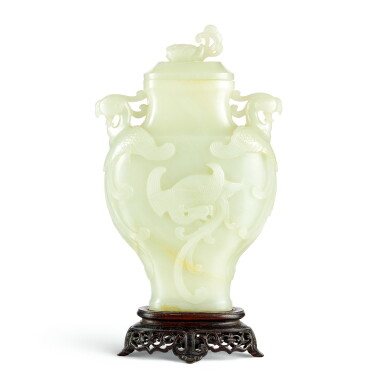 View full screen - View 1 of Lot 3647. A pale celadon jade 'phoenix' vase and cover Qing dynasty, 18th century | 清十八世紀 青白玉飛鳳鳳耳蓋壺.