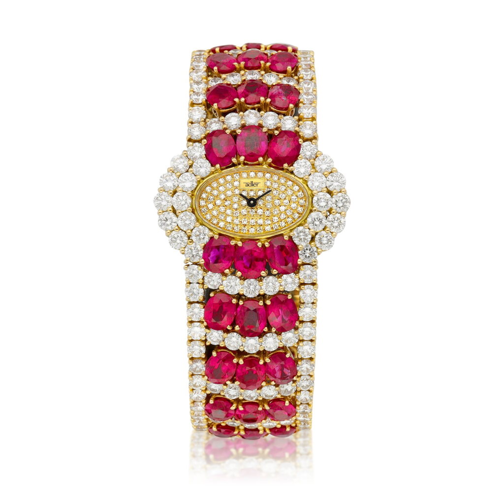 View full screen - View 1 of Lot 8604. A yellow gold, diamond and ruby-set bracelet watch, Circa 2000 | 黃金鑲鑽石及紅寶石鏈帶腕錶,約2000年製.