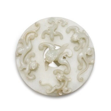 View full screen - View 1 of Lot 39. A rare large white jade 'dragon and phoenix' disc, bi Qing dynasty, 18th century | 清十八世紀 白玉仿古螭龍鳳紋璧.