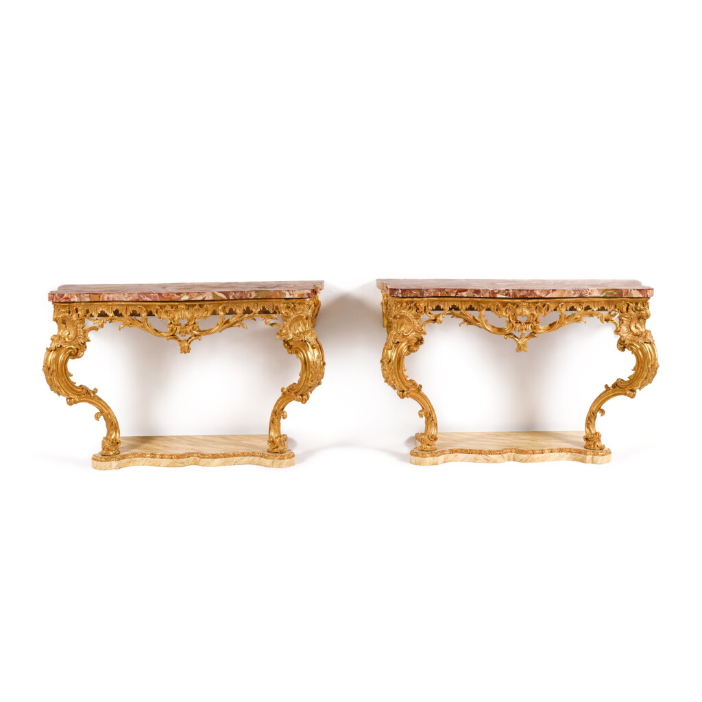 View full screen - View 1 of Lot 9. A pair of George III style carved giltwood console tables.