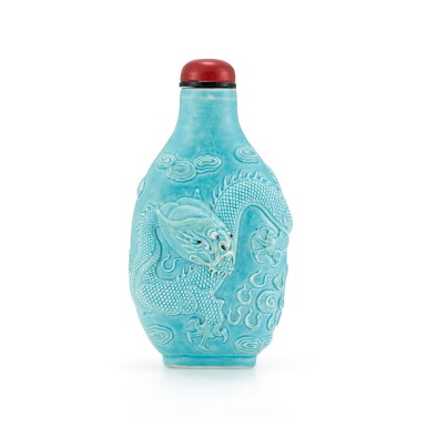 View full screen - View 1 of Lot 3010. A Turquoise-Glazed Carved 'Dragon' Porcelain Snuff Bottle By Wang Bingrong, Qing Dynasty, Jiaqing - Daoguang Period | 清嘉慶至道光 松綠彩浮雕雲龍逐珠圖鼻煙壺 《王炳榮作》款.