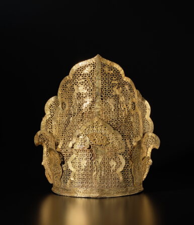 View full screen - View 1 of Lot 261. A rare and important gilt-silver filigree 'phoenix' crown, Liao dynasty | 遼 銀鎏金鏤空鳳鳥紋冠.