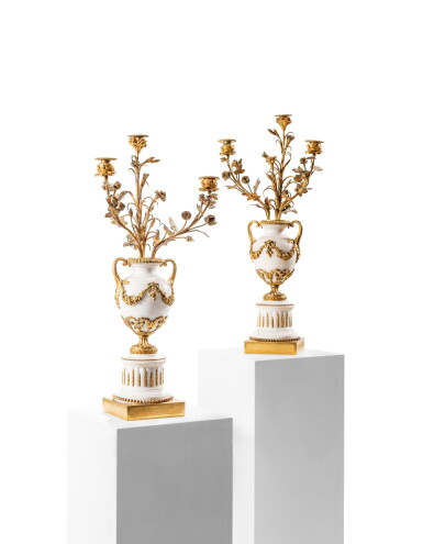 View full screen - View 1 of Lot 168. A pair of Louis XVI style gilt-bronze and white marble three-light candelabra, second half of the 19th century, attributed to Eugène Hazart .