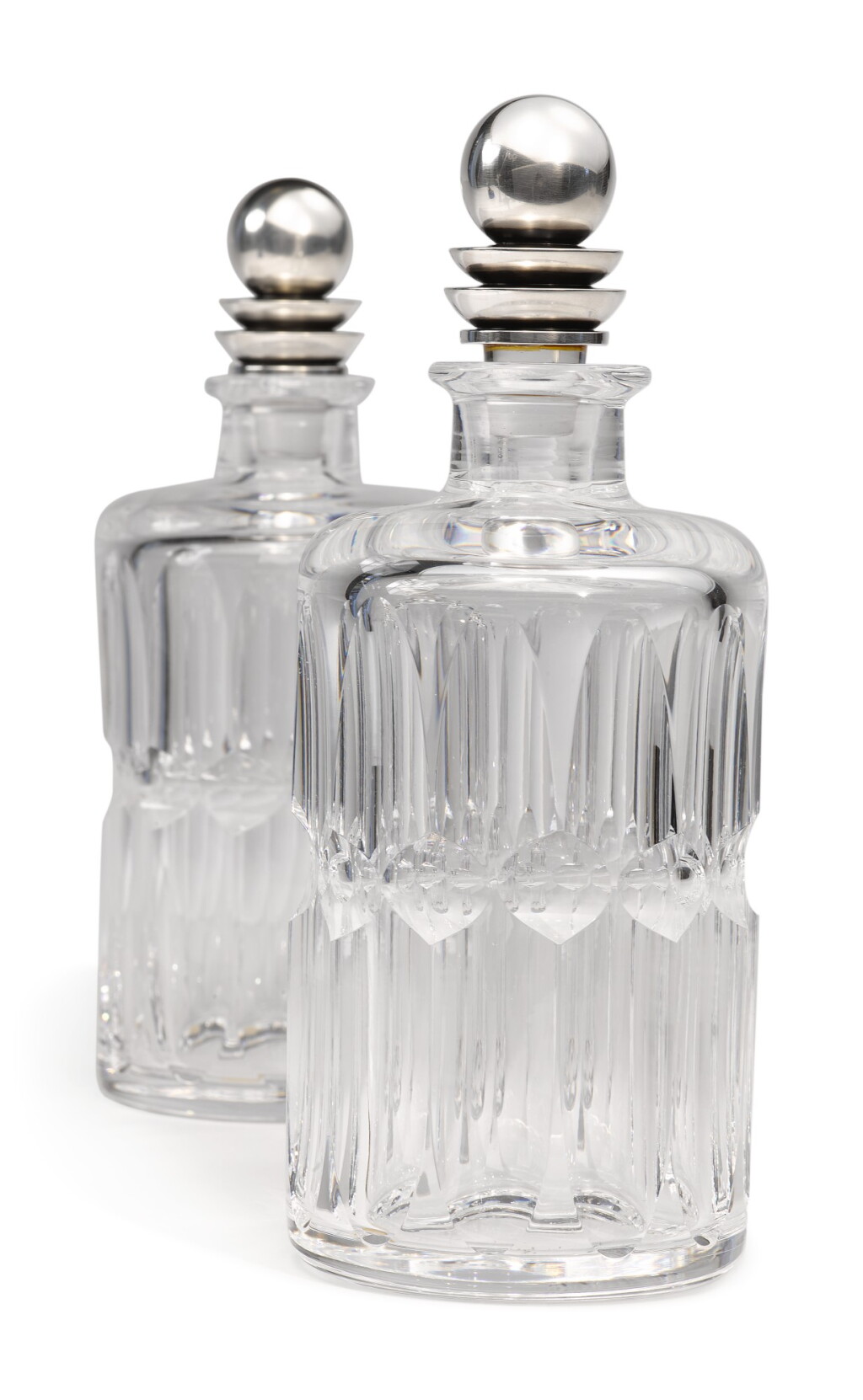 View full screen - View 1 of Lot 327. A PAIR OF GLASS DECANTERS WITH DANISH SILVER STOPPERS, NO. 206C, DESIGNED BY HARALD NIELSEN, GEORG JENSEN SILVERSMITHY, COPENHAGEN, CIRCA 1915-27.