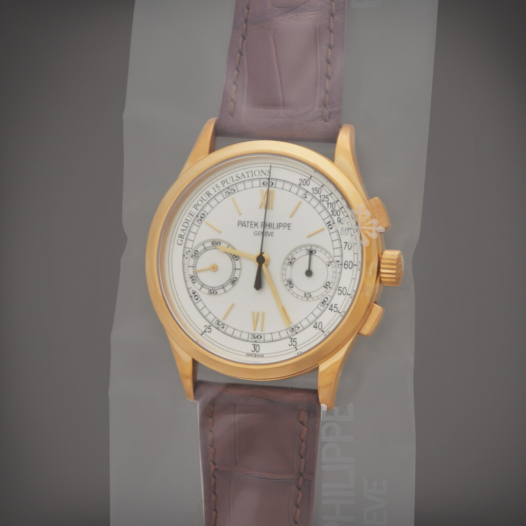 View full screen - View 1 of Lot 154. Reference 5170J-001 | A yellow gold chronograph wristwatch with pulsation scale, Single Sealed, Circa 2011.