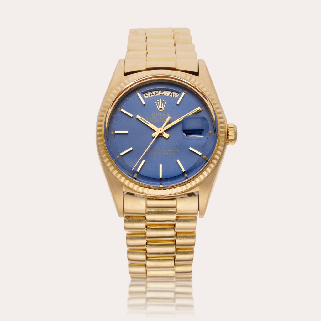View full screen - View 1 of Lot 311. Reference 1803 Day-Date | A yellow gold automatic wristwatch with day, date, and bracelet, Circa 1970.