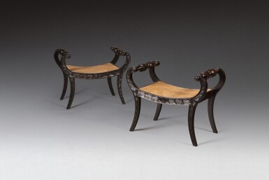 View full screen - View 1 of Lot 157. A pair of carved ebony stools, circa 2000 | Paire de tabourets en ébène sculptée, vers 2000.