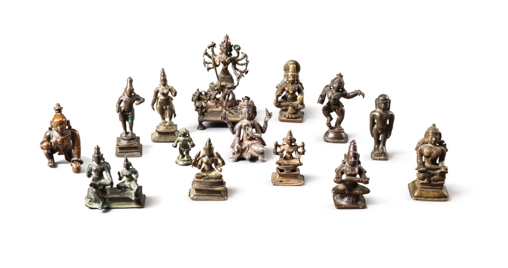 View full screen - View 1 of Lot 93. A group of fifteen small copper-alloy figure of deities India, 15th-19th century | 印度 十五至十九世紀 合金銅佛像一組十五件.