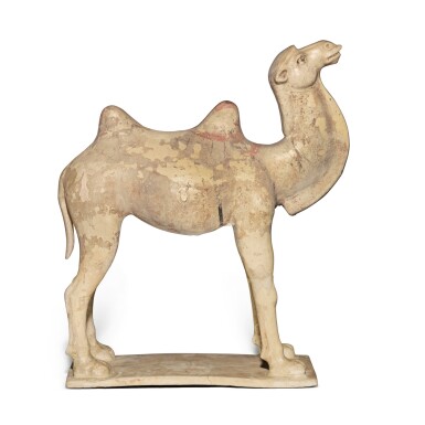 View full screen - View 1 of Lot 963. A painted straw-glazed pottery figure of a camel, Tang dynasty | 唐 白釉加彩駱駝.
