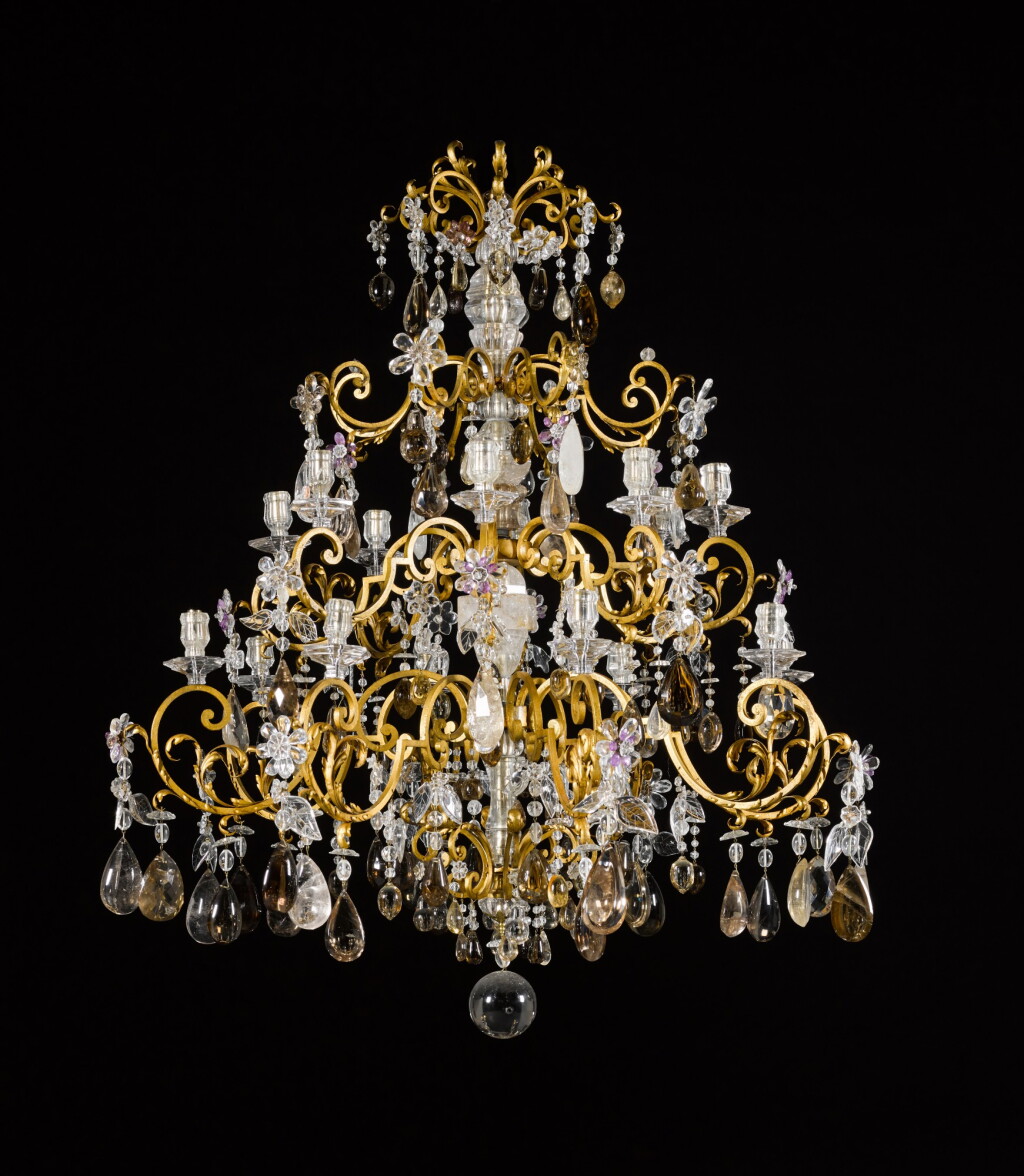 View full screen - View 1 of Lot 92. A French rock crystal and gilt-iron sixteen-light chandelier, in 18th century style.