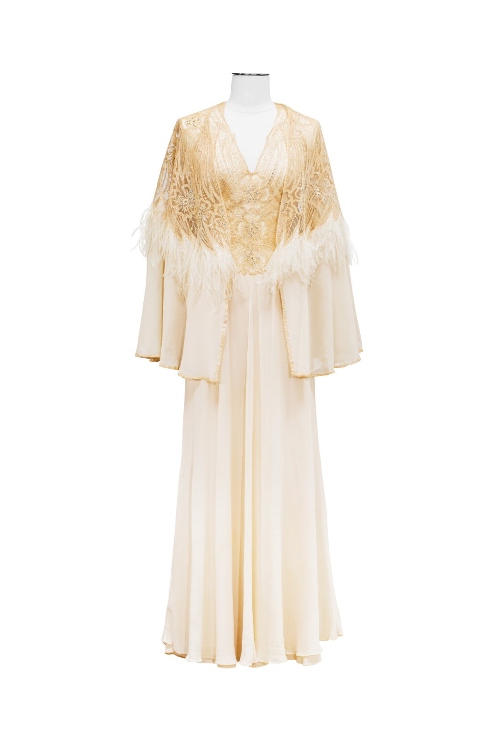 View full screen - View 1 of Lot 67. Balestra, Haute Couture, circa 1975, Muslin evening dress, tulle bodice and matching cape | Robe du soir sans manches en mousseline, corsage en tulle.