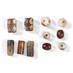 A group of eleven jade and glass beads, Eastern Zhou dynasty, Warring States period | 東周戰國 各式玉珠和料珠一組十一件
