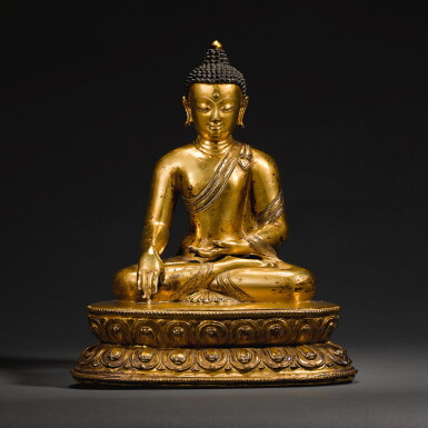 View full screen - View 1 of Lot 150. A LARGE GILT-COPPER-ALLOY FIGURE OF SHAKYAMUNI BUDDHA, TIBET, 14TH/15TH CENTURY | 十四/十五世紀 藏傳鎏金銅合金釋迦牟尼佛坐像.