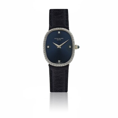 View full screen - View 1 of Lot 128. PATEK PHILIPPE | REF 4382 ELLIPSE, A WHITE GOLD AND DIAMOND SET OVAL WRISTWATCH CIRCA 1985.