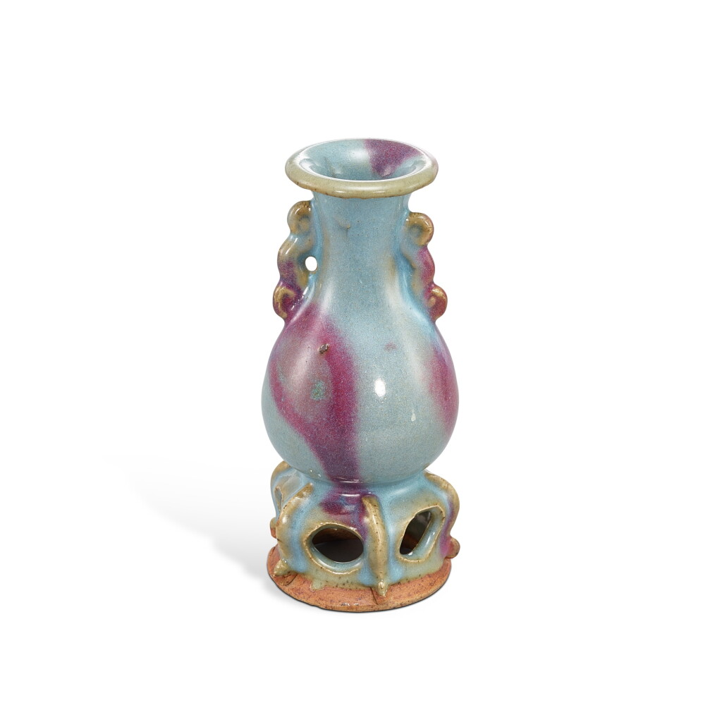 View full screen - View 1 of Lot 3671. A small Junyao purple-splashed handled vase, Jin - Yuan dynasty | 金至元 鈞窰天藍釉紫斑雙耳連座瓶.