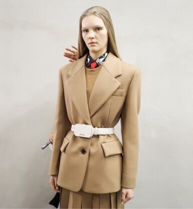View full screen - View 1 of Lot 24. PRADA | WOOL JACKET AND SKIRT, POPLIN SHIRT AND TIE, CASHMERE KNITWEAR AND VANITY BELT, WORN BY VIKTORIA LULKO.