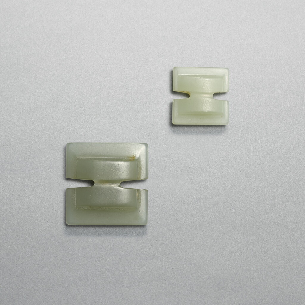 View full screen - View 1 of Lot 757. Two pale celadon jade ‘gong’ pendants, Han dynasty | 漢 青白玉工字珮兩件.