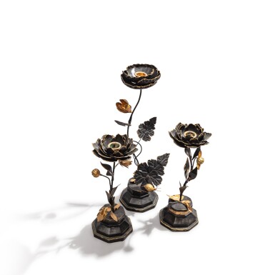View full screen - View 1 of Lot 77. A set of three patinated and gilt metal candlesticks, modern.