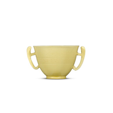 View full screen - View 1 of Lot 11. A yellow-glazed handled cup, Mark and period of Kangxi | 清康熙 黃釉暗刻龍紋耳盃 《大清康熙年製》款.