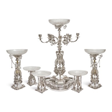 View full screen - View 1 of Lot 261. A VICTORIAN SILVER-PLATED AND CUT-GLASS SEVEN-PIECE TABLE GARNITURE, PROBABLY DESIGNED BY A.A. WILLMS, ELKINGTON & CO., CIRCA 1865.