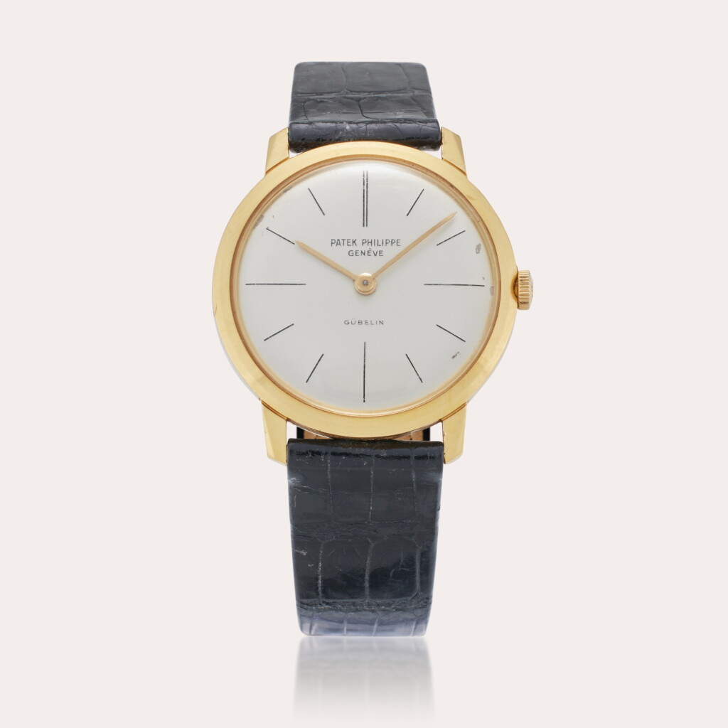 View full screen - View 1 of Lot 243. Reference 2593 Calatrava | Retailed by Gübelin: A yellow gold wristwatch, Circa 1958.