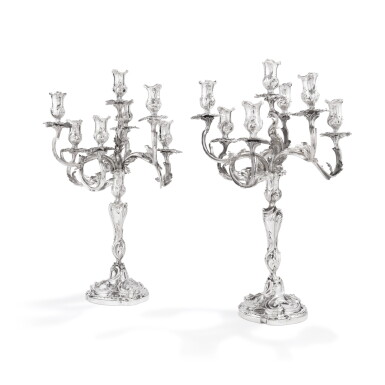 View full screen - View 1 of Lot 344. A pair of silver Louis XV style 7-light candelabra, Paris, modern | Paire de chandeliers à 7 lumières de style Louis XV en argent, Paris, moderne.